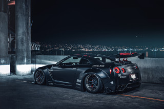 Black sports car parking lot 29 - a surfboard free wallpaper