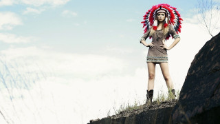 Woman red headdress rock formation - grass and trees free wallpaper