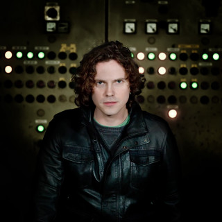 Man black jacket control panel - private press free wallpaper
