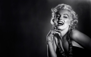 Woman laughing necklace cell phone - both hand free wallpaper