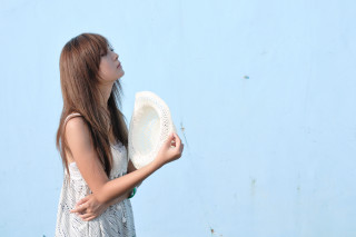 Woman holding white frisbee blue - blue sky free wallpaper