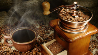 Coffee grinder cup beans pile - a pile of coffee beans free wallpaper