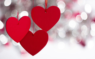 Red hearts hanging strings blurry - anne dunn free wallpaper