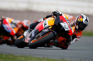 Motorcycle race track rider helmet - dynamic camera angle free wallpaper