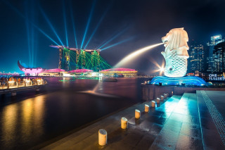 Mermaid statue city skyline night - adrian zingg free wallpaper