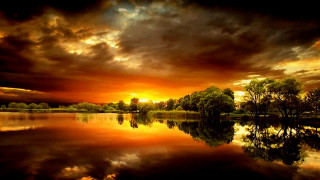 Sunset lake trees clouds dark 2 - a sunset over a lake free wallpaper