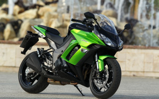 Green motorcycle road fountain rocks - a green motorcycle free wallpaper