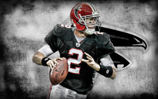 Football player holding football helmet - a football player holding free wallpaper