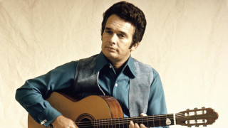 Man holding guitar blue shirt - dennis flanders free wallpaper