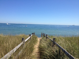 Beach path ocean boats fence - the water behind free wallpaper