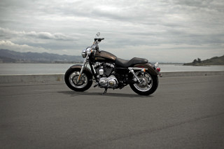Motorcycle parked ocean mountains cloudy - cafer bater free wallpaper