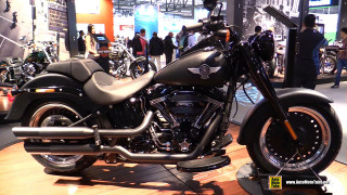 Motorcycle showroom display people looking 2 - a motorcycle free wallpaper