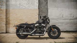 Motorcycle parked brick building graffiti - david budd free wallpaper