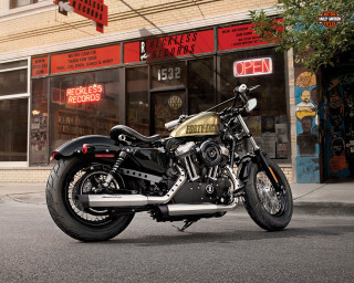 Motorcycle parked storefront red sign - a red sign free wallpaper