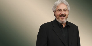 Bearded man smiling black suit - a black suit free wallpaper
