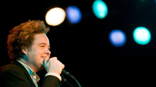 Curly man singing microphone night - a concert free wallpaper