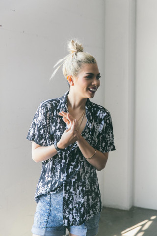 Woman standing hands together smiling - free vintage wallpaper