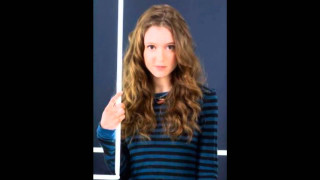 Woman thumbs up blue wall - beatrice huntington free wallpaper