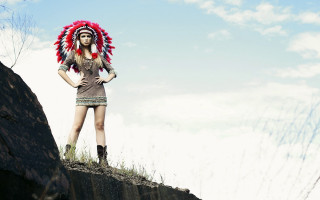 Woman headdress cliff grass rocks - primitivism free wallpaper