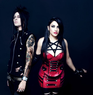 Man woman leather outfits posing - a man and a woman free wallpaper