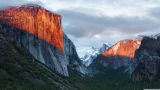 Mountain range snow covered cloudy - mountain in the background free wallpaper