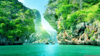 Beautiful view water mountain boat 2 - a mountain in the background and a boat free wallpaper