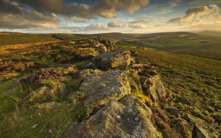 Rocky hillside grass sunset clouds - widescreen free wallpaper