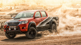 Red truck driving dirt road - pathfinder free wallpaper