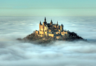 Castle foggy sky clouds trees - a few cloud below free wallpaper
