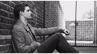 Man sitting brick wall fence - private press free wallpaper