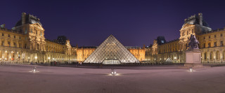 Large building pyramid nighttime lights - cubist free wallpaper