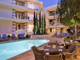 Hotel pool lounge chairs nighttime - elbridge ayer burbank free wallpaper