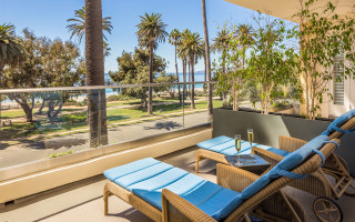 Balcony chairs table beach view - modernism free wallpaper
