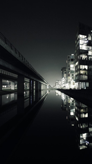 Train night tall buildings reflection - cinematic photography free wallpaper
