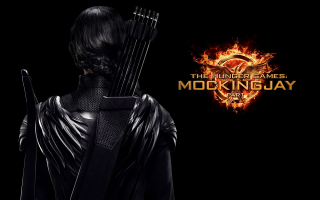 Woman black outfit bow arrow 2 - a black outfit holding free wallpaper