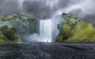 Man waterfall cloudy sky person 2 - a matte painting free wallpaper for desktop