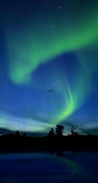 Green blue aurora borealis lake 2 - free airplane wallpaper