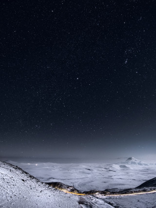 Snowy mountain road night sky - a road free wallpaper