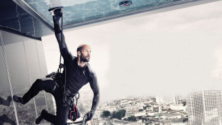Man hanging highrise city skyline - arnold brügger free wallpaper