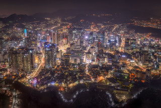 City night lights buildings mountains - choi buk free wallpaper