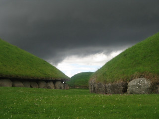 Grass houses lush field stormy - a lush green field under a cloudy sky free wallpaper