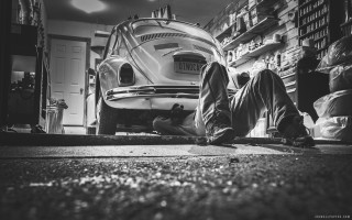 Man laying ground car garage - mechanical free wallpaper