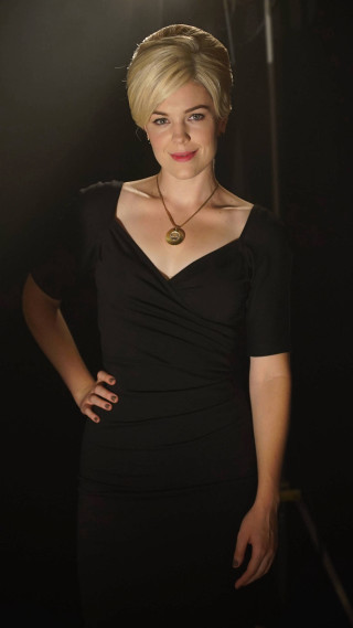 Woman black dress spotlight pose - a character portrait free wallpaper