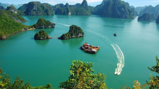 Boat traveling water mountains trees - a large body of water free wallpaper