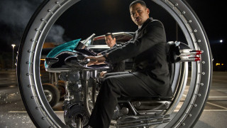 Man suit motorcycle parking lot - a car in the background free wallpaper