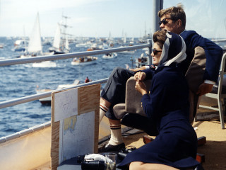 Man woman boat water sailboats - a sailboat in the background free wallpaper