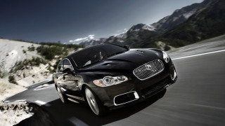 Black car mountain road snow - cloud and snow free wallpaper