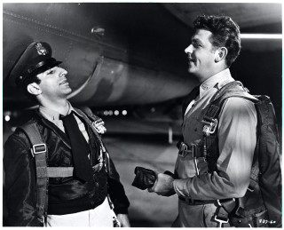 Man pilot uniform talking another - movie still free wallpaper