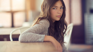 Woman sitting table laptop serious - elinor proby adams free wallpaper
