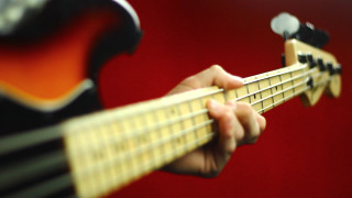 Person playing guitar red background - a person playing free wallpaper